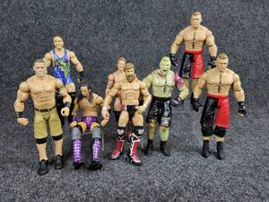 lot 2069 image: Lot of (8) WWE Wrestlers from 2012-2017 by Mattel