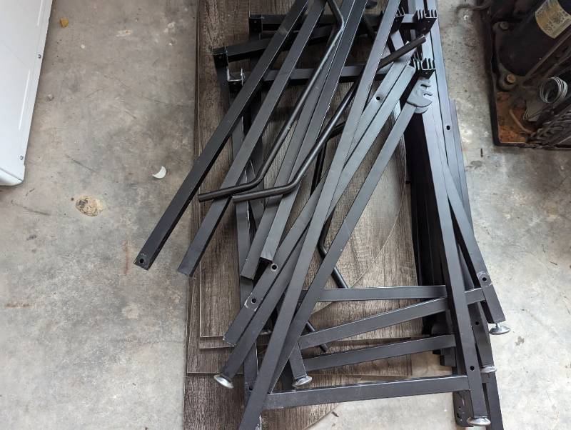 Unassembled table with 4 top sectio...