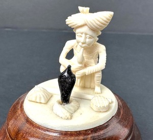 lot 60 image: Miniature Bone Carved Snake Charmer Figurine