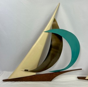 lot 79 image: Pair of Mid Century Modern Walnut and Metal Sail Boat Decorative Wall Figurines