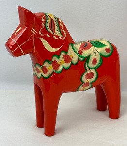 lot 141 image: Swedish Delights Three Dala Horses and a Swedish Candle Figurine