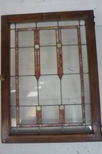 leaded stained glass window with broken part of glass