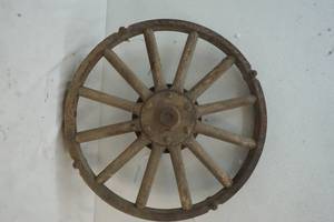 vintage iron wheel with wooden spokes