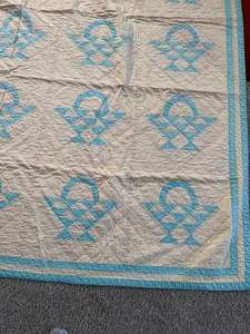 Blue and Yellow Patterned Quilt with Kids Quilt