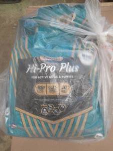 lot 823 image: 50 lb Bag of Classic Hi-Pro Plus Dog Food for Active Dogs and Puppies - Small Rip in Bag - SOLD AS IS