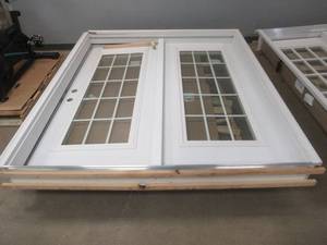 lot 826 image: MMI Patio Door, Approximately 71 x 81,  34 Door RH Swing, RH Side Light is Fixed, Grill is on the Interior, Has Internal Blinds, Slight Scratch and Dent, Brickmold is Cracked in Corner, SOLD AS IS