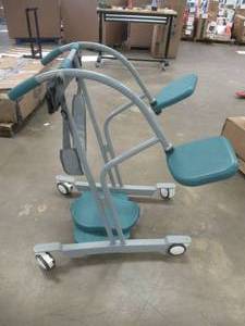 lot 856 image: Manual Standing Aid (WHEELS NEED SOME WORK, MISSING NUTS & BOLTS FOR THE CHAIR)