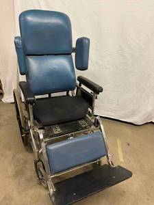 lot 28 image: WOW MSRP $7000 Invacare HTR Tilt & Recline Chair RECLINING WHEELCHAIR With Removable Table - Good Working Condition  Needs Sone Clean Up