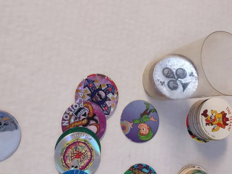 lot 88 image: Tube Full of Random Pogs from All Years