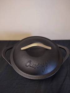 lot 4 image: Chrissy Teigen Cravings 5 Quart Black Cast Iron Dutch Oven with Lid