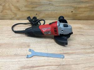 lot 76 image: MILWAUKEE 7 Amp Corded 4-12 in. Small Angle Grinder with Sliding Lock-On Switch