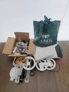 lot 31 image: Nintendo WII With Games And Accessories