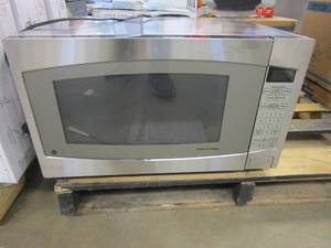 lot 554 image: GE 2.2 cu. ft. Countertop Microwave in Stainless Steel with Defrost and Sensor Controls (OUT OF BOX)
