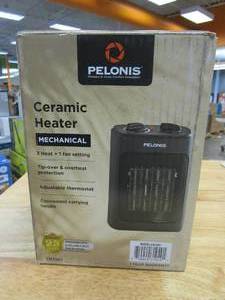 lot 558 image: Pelonis 1500-Watt 9 in. Electric Personal Ceramic Space Heater with Thermostat (SLIGHTLY USED)