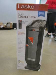 lot 676 image: Lasko Tower 22 in. Electric Ceramic Oscillating Space Heater with Digital Display and Remote Control (OPEN BOX)