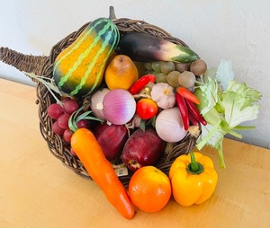 lot 47 image: Wicker Cornucopia with Faux Fruit and Vegetables