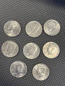lot 56 image: Lot of 8 Kennedy Half Dollars