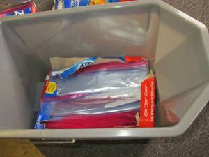 lot 317 image: bucket with 3 packages of opened zi...
