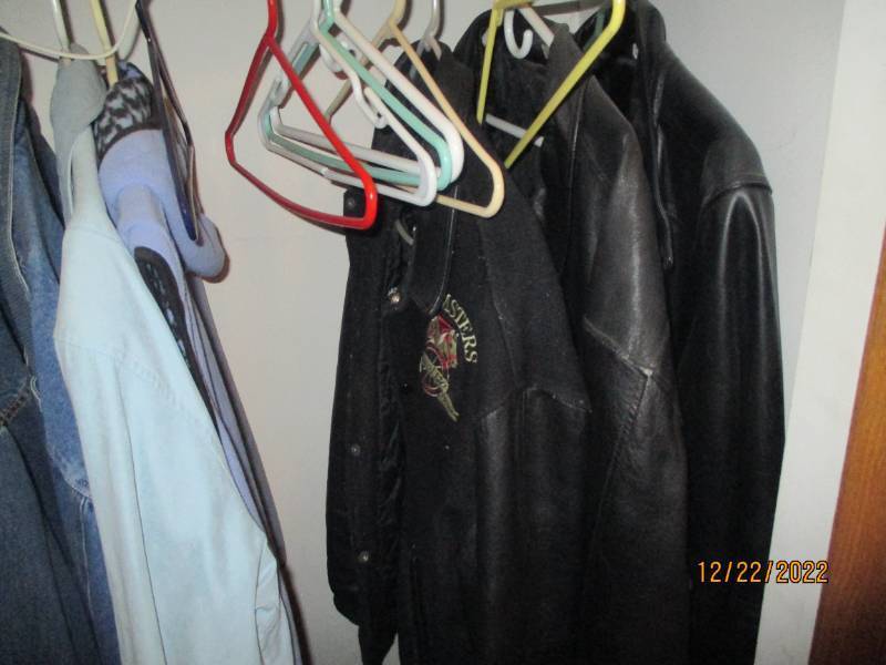 Closet full of clothes and househol...