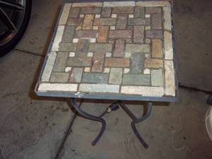 lot 51 image: Mosaic topped metal base patio tabl...