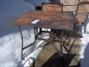 lot 47 image: Square slate tile topped patio tabl...