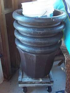 lot 58 image: 4 Large planters on a wheeled cart ...