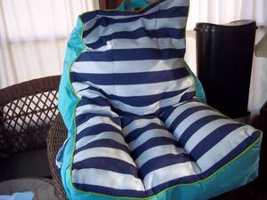 lot 65 image: Bean Bag lounge chair and the rug on the floor.