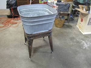 lot 74 image: Antique wash tub on stand.