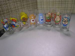 lot 245 image: Collectible drinking Glasses featuring The Three Chipmunks, The Smurfs and Care Bears