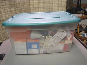 lot 250 image: Covered tote with a variety of bulbs to Lighten Up all the rooms in your house