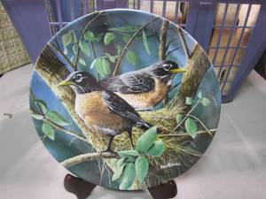 lot 257 image: From the Edwin M Knowles China Co is a basket with a variety of bird collector plates as well as plate display holders