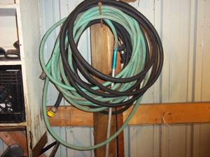 lot 296 image: Water the lawn using a couple of hoses and sprinklers