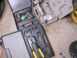 lot 306 image: Soldering Iron,  Crimping Tool and electric filet knife each in their respective cases