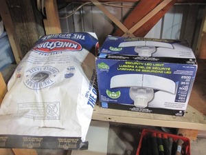 lot 357 image: LED security light (in original box) and a bag of charcoal