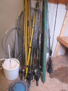 lot 384 image: Lot of fishing poles with live trap and bait bucket