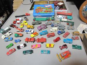 lot 418 image: Large lot of Vintage die cast Hot Wheels cars, trucks and jeep with collector case.
