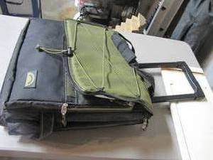 lot 428 image: Nice portable soft-sided cooler with wheels and a telescoping handle for convenience. Good sized, good condition.