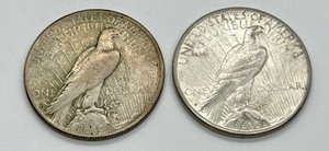 lot 100 image: (2) 1922- S Peace Silver Dollars