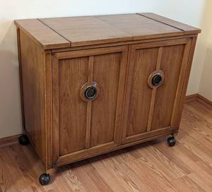 lot 14 image: Vintage Rolling Wood Buffet