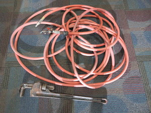 lot 104 image: RIGID MONKEY WRENCH AND AN AIR HOSE
