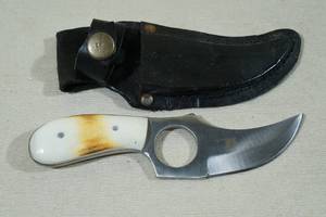 lot 96 image: Skinning Knife with Finger Hole and Sheath
