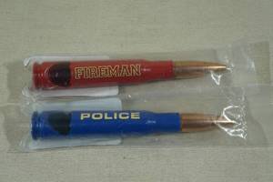lot 112 image: 2 50 Cal Bullet Bottle Openers -Fireman, Police