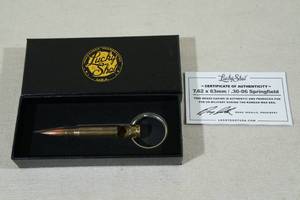 lot 121 image: Lucky Shot Keychain Bottle Opener -Bullet Used in Korean War Era