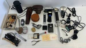 lot 38 image: Group Of Misc. Vintage Camera Items Including Camera Case, Lens Case, Flashes And More