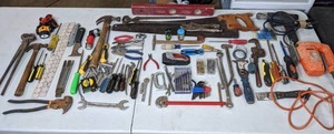 lot 93 image: Collection of Hand Tools (Hammers, Saw, Screwdrivers, Pliers, Measuring Tape, Sockets, and Much More), Black and Decker Variable Speed Jigsaw, and Milwaukee Heat Gun  M