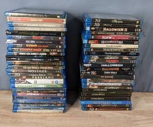 lot 58 image: Stack of (50) Blu-Ray DVDs Jurassic Park, Star Wars, Rampage, King Kong, World War Z, The Green Mile, Pirates of the Caribbean, The Conjuring, Halloween, Pet Sematary and More T