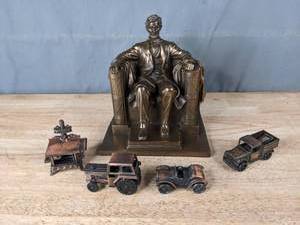 lot 73 image: Abraham Lincoln Figurine, Miniature Cast Iron Stove, Miniature Truck Pencil Sharpener and Miniature Car Figurine  T