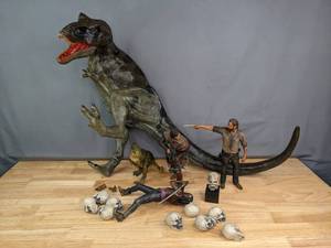 lot 69 image: Large Dinosaur Figurine, Walking Dead Daryl, Michone, and Rick Figurines T