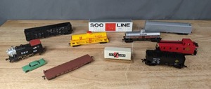 lot 351 image: A Collection of Used Train Freight Cars, Engines and a Blue Toy Car   D
