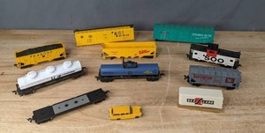 lot 352 image: An Assortment of Various Train Freight Cars and One Small Yellow Toy Car  D